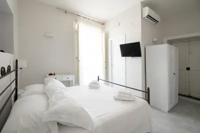 Letto o letti in una camera di EFFE SUITES