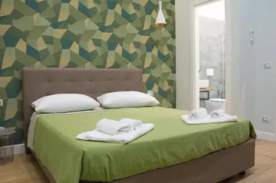 Letto o letti in una camera di WANDERLUST NAPLES a place to stay