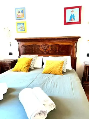 Letto o letti in una camera di San Gregorio Luxury Apartments