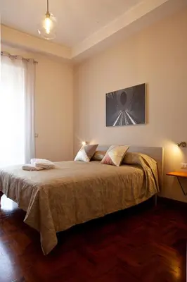 Letto o letti in una camera di LE STANZE DI PARTENOPE