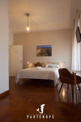 Letto o letti in una camera di LE STANZE DI PARTENOPE