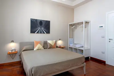 Letto o letti in una camera di LE STANZE DI PARTENOPE