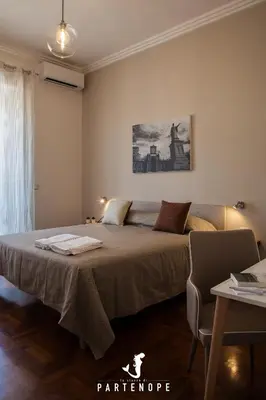 Letto o letti in una camera di LE STANZE DI PARTENOPE