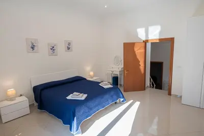 Letto o letti in una camera di Appartament Terra mia