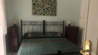 Letto o letti in una camera di La stanza di Zeza