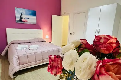 Letto o letti in una camera di Bed Boutique Napoli Colors