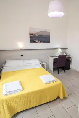 Letto o letti in una camera di B&B Solimena