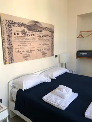 Letto o letti in una camera di BnB Naples