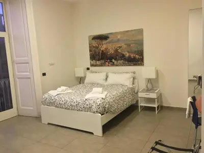 Letto o letti in una camera di BnB Naples