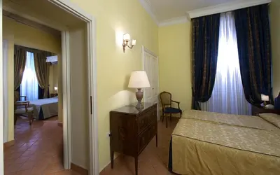 Letto o letti in una camera di Chiaja Hotel de Charme
