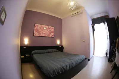 Letto o letti in una camera di Hotel Nettuno