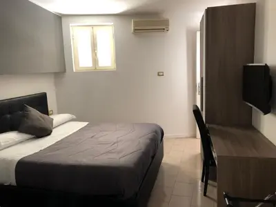 Letto o letti in una camera di Hotel Nettuno