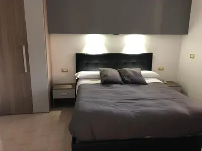 Letto o letti in una camera di Hotel Nettuno