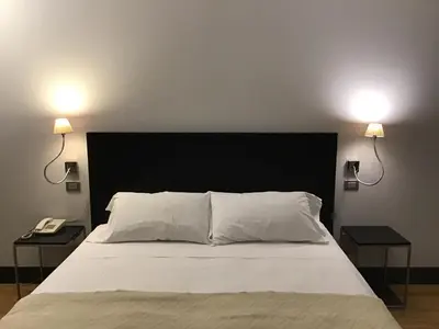 Letto o letti in una camera di MH Design Hotel