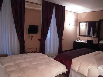 Letto o letti in una camera di MH Design Hotel