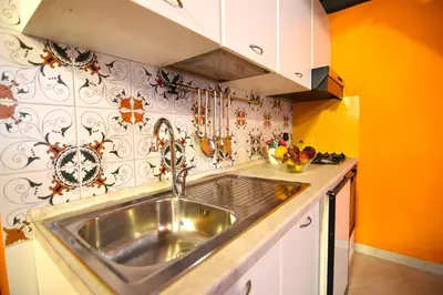 Cucina o angolo cottura di Case Così Apartments - Napoli