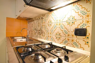 Cucina o angolo cottura di Case Così Apartments - Napoli