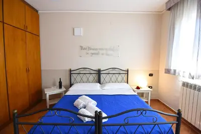 Letto o letti in una camera di Case Così Apartments - Napoli