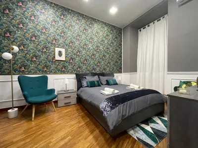 Letto o letti in una camera di DUOMO Luxury Apartment in City Center