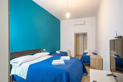 Letto o letti in una camera di Stay in Naples Flats Toledo