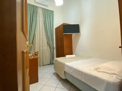 Letto o letti in una camera di Hotel Eliseo Napoli