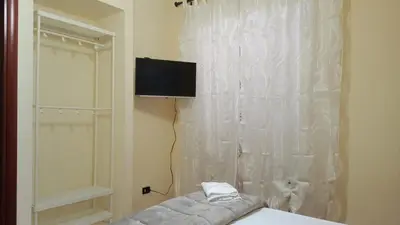 Letto o letti in una camera di Hotel Eliseo Napoli