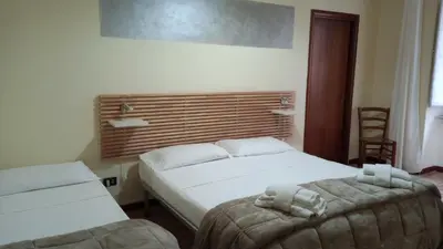 Letto o letti in una camera di Hotel Eliseo Napoli