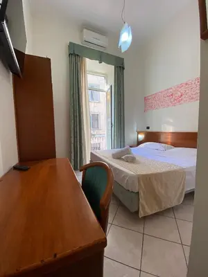 Letto o letti in una camera di Hotel Eliseo Napoli