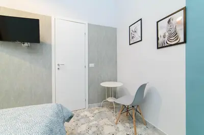 Letto o letti in una camera di Sofia Rooms