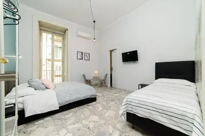 Letto o letti in una camera di Sofia Rooms
