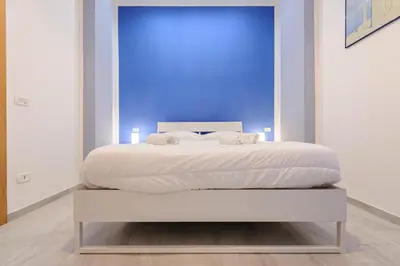 Letto o letti in una camera di Via Aniello Falcone 72b