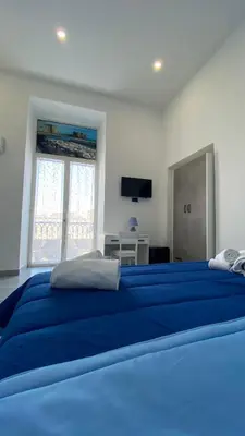 Letto o letti in una camera di HEART OF NAPLES