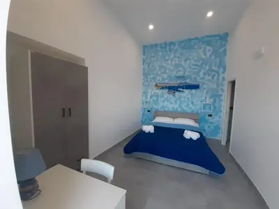 Letto o letti in una camera di HEART OF NAPLES