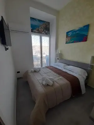 Letto o letti in una camera di HEART OF NAPLES