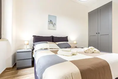 Letto o letti in una camera di GuestHost - Vomero Deluxe Apartments