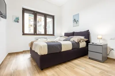 Letto o letti in una camera di GuestHost - Vomero Deluxe Apartments