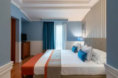 Letto o letti in una camera di Palazzo Turchini