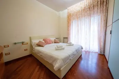 Letto o letti in una camera di Spazio Napoletano by Dimorra