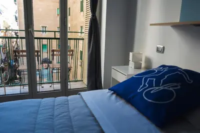 Letto o letti in una camera di B&B i Murales