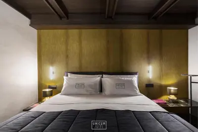 Letto o letti in una camera di Unicum Suite Napoli Centro Storico