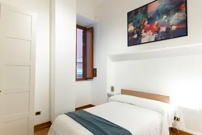Letto o letti in una camera di Dimora del Fico - Appartamento elegante e spazioso