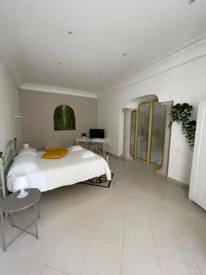 Letto o letti in una camera di Napule è ...