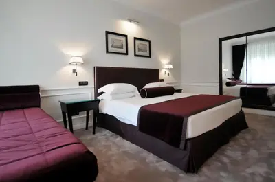 Letto o letti in una camera di Grand Hotel Oriente