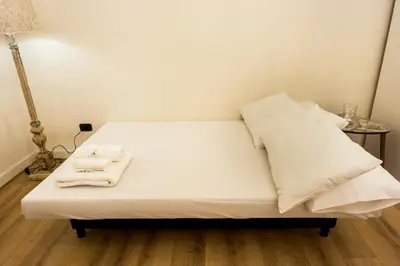Letto o letti in una camera di Residenza Sforza Apartment 1