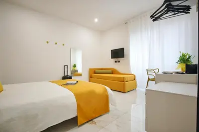 Letto o letti in una camera di Be Coloured - Boutique Art Rooms in Naples