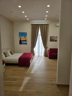Letto o letti in una camera di Toto e Peppino Luxury Rooms