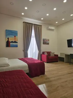 Letto o letti in una camera di Toto e Peppino Luxury Rooms