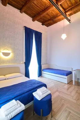 Letto o letti in una camera di Toto e Peppino Luxury Rooms