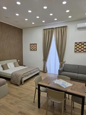 Letto o letti in una camera di Toto e Peppino Luxury Rooms