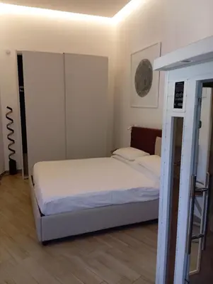 Letto o letti in una camera di Neruda Chic House Vomero